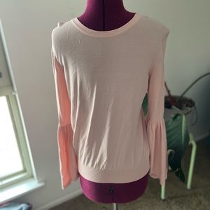 Light pink top with long bell sleeves